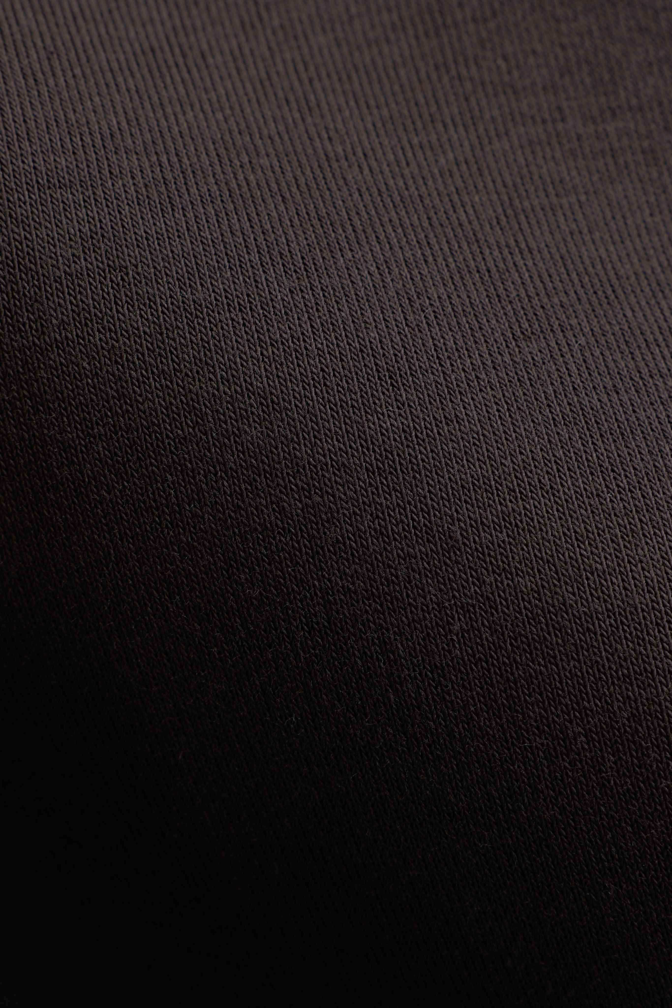 Close-up texture of the espresso brown fabric on the CASPARA CS hoodie.